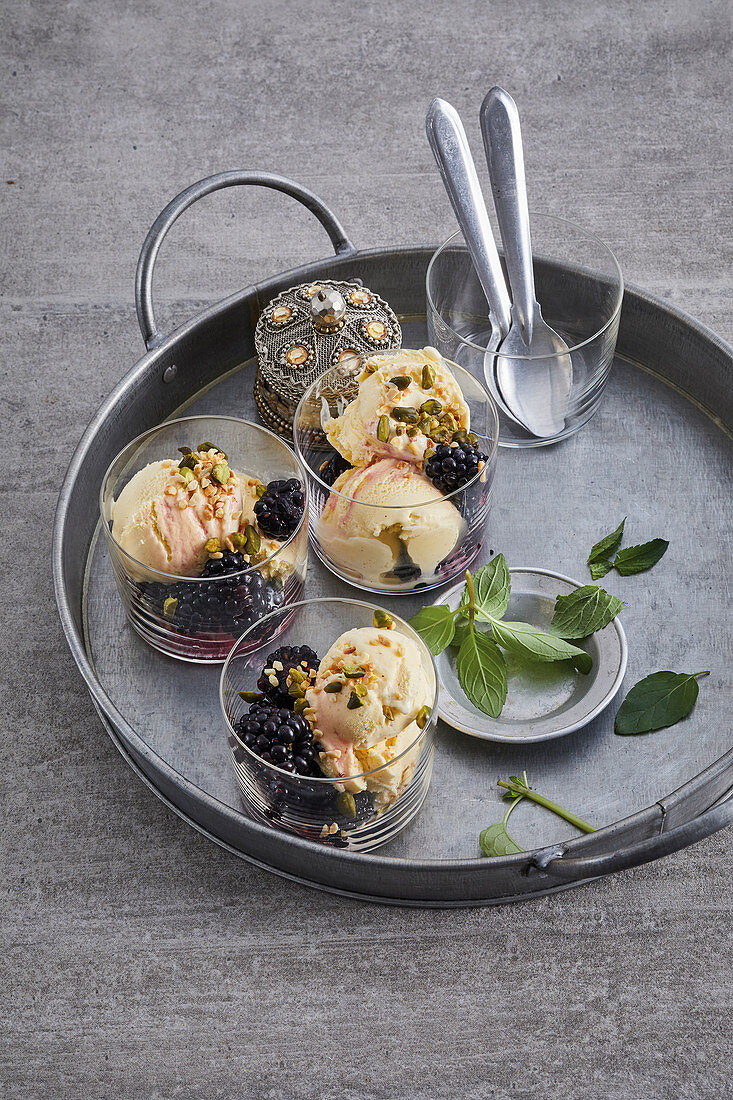 Vanilla ice cream on Bombay gin blackberries with pistachios and almonds