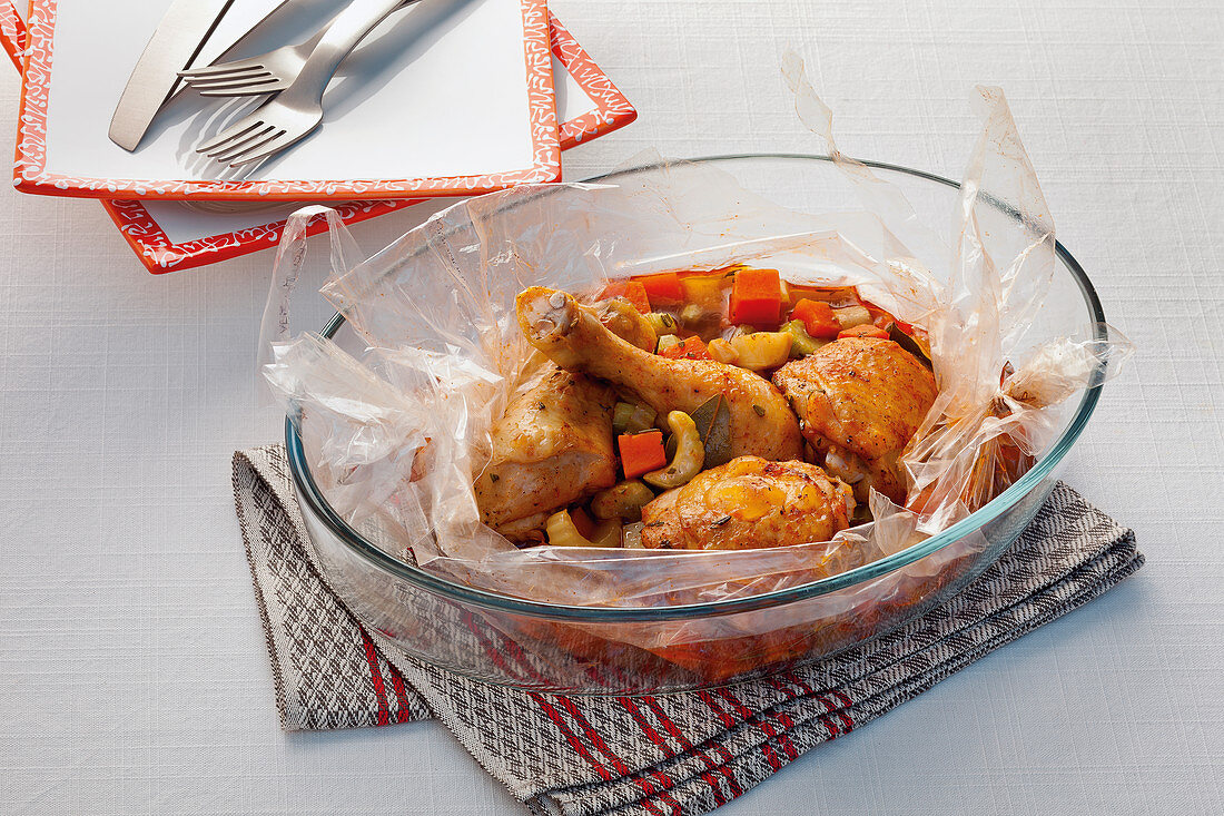 Chicken legs with vegetables in an oven bag