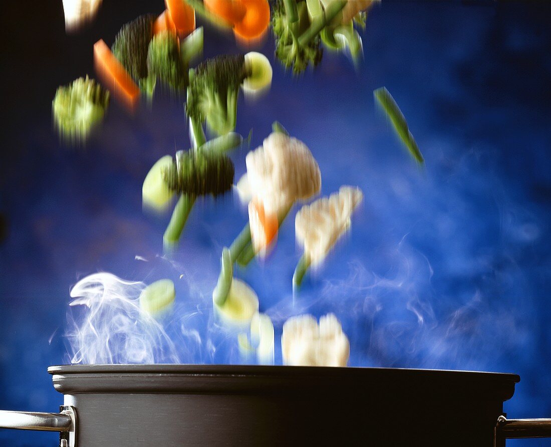 Steamed Vegetables Being Thrown From a Pot