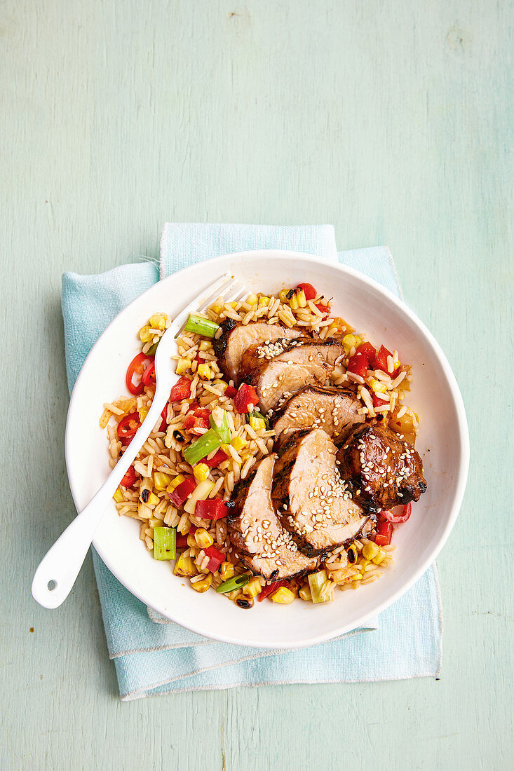 Spicy Korean pork with grilled corn and rice salad