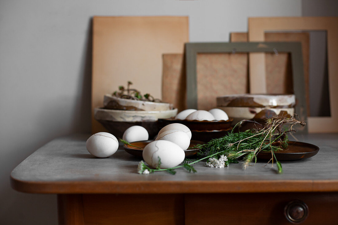 Easter eggs colored with coffee and decorated with cosmetic pencil