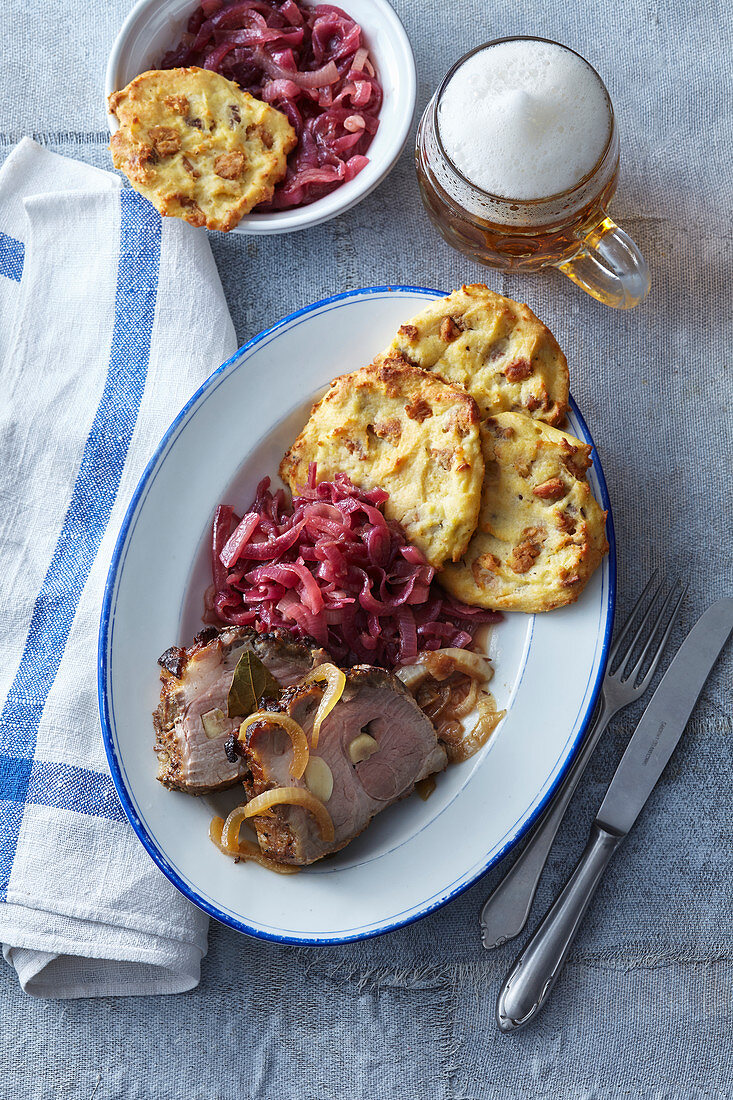 Neck on beer with onion cabbage and pancakes