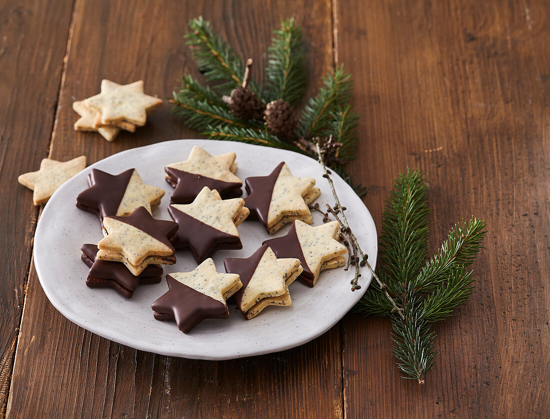 Poppy seed stars with jam and chocolate icing