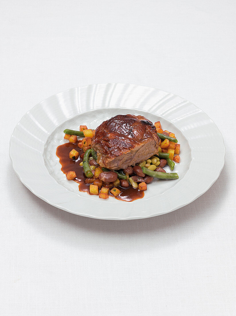 Braised shoulder of lamb with beans