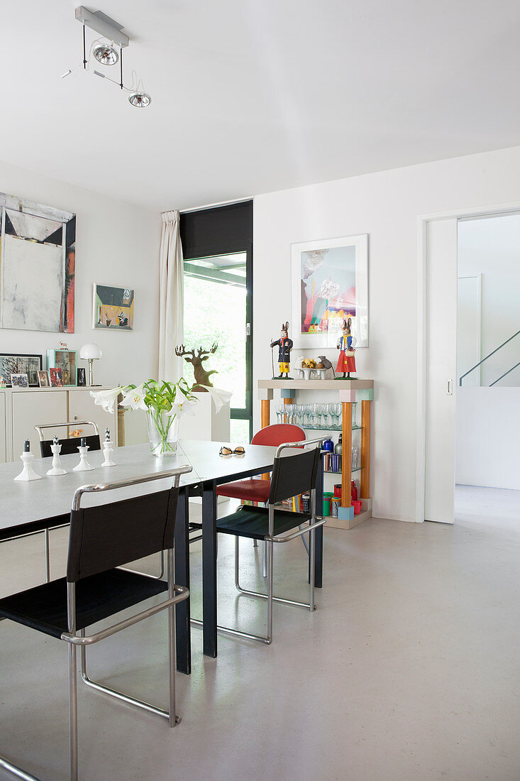 Modern furniture in dining room with white floor