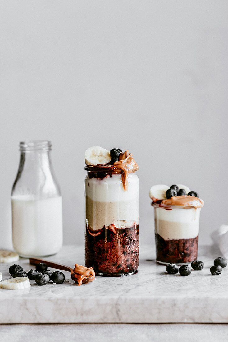 Dessert in a jar with blueberries peanut butter and banana mousse