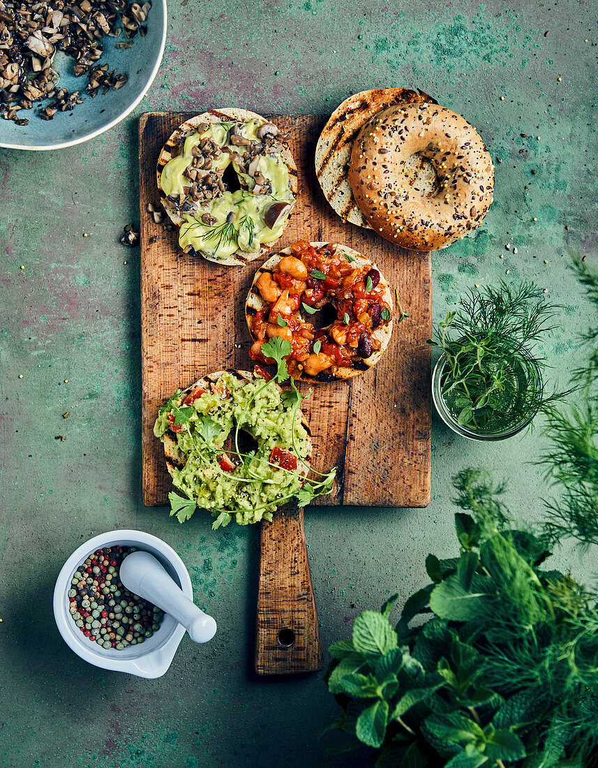 Bagels with various spreads (mushroom mayonnaise, guacamole, bean and tomato)