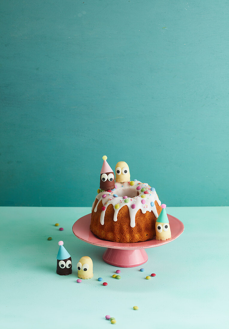 A birthday Bundt cake with chocolate marshmallow people