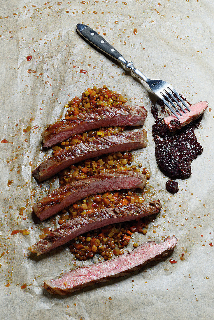 Flank steak with purple mustard and alba lentil ragout