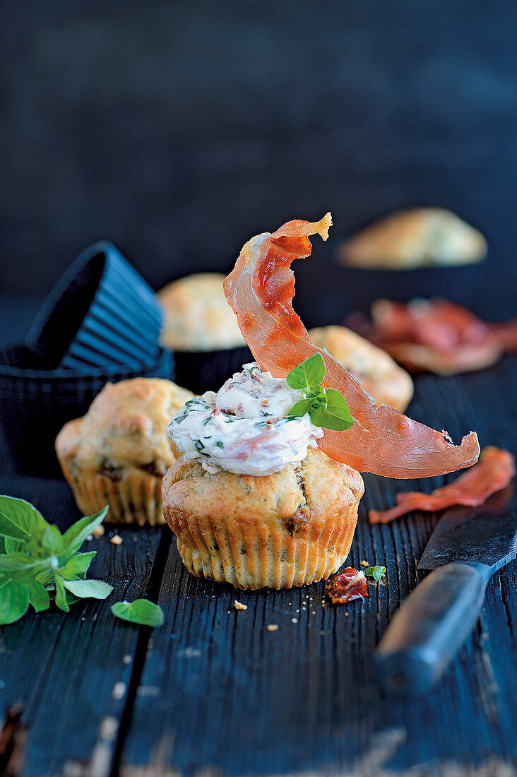 Herb and tomato cupcakes with serrano ham topping