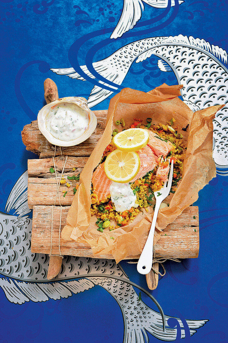 Salmon with vegetable couscous in parchment paper with mint dip