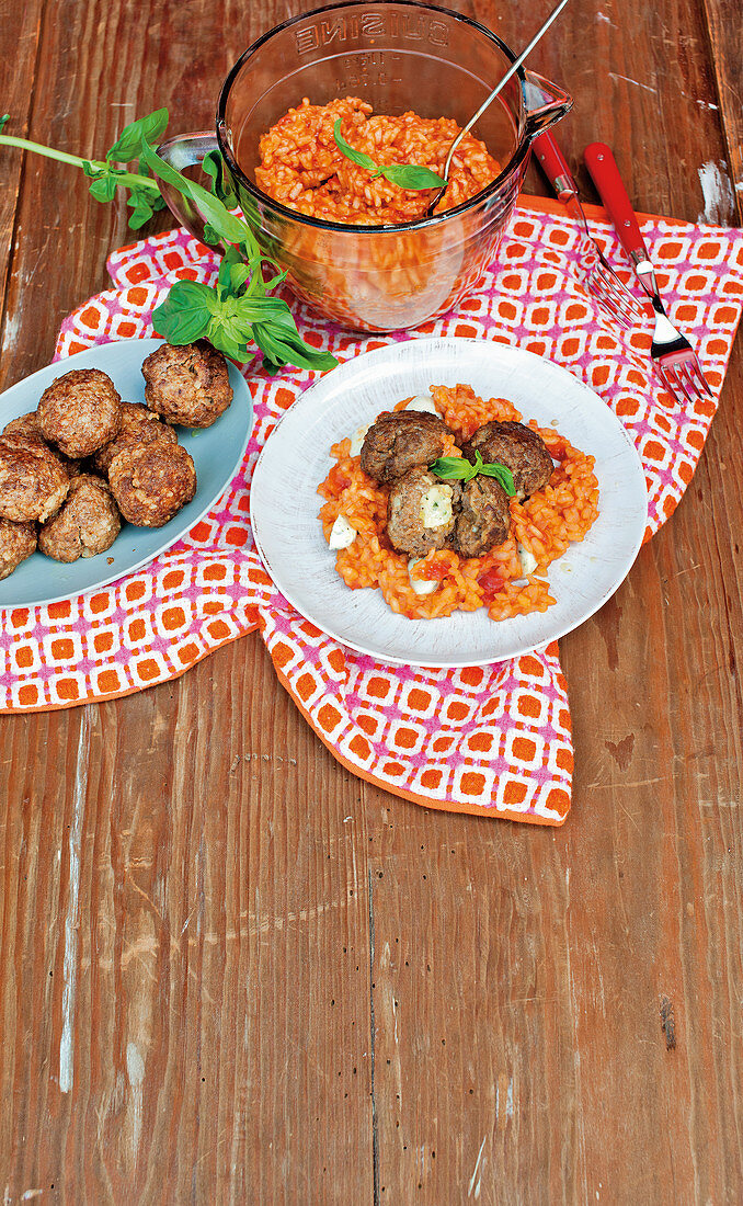 Minced meat and mozzarella balls with tomato risotto
