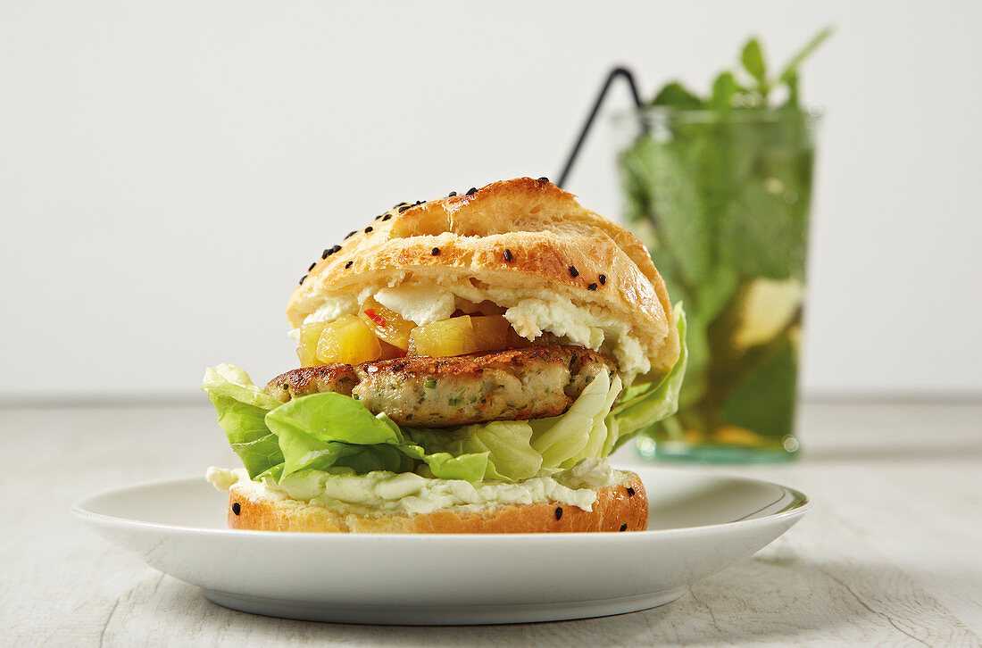 A fish burger with a pineapple and chilli chutney