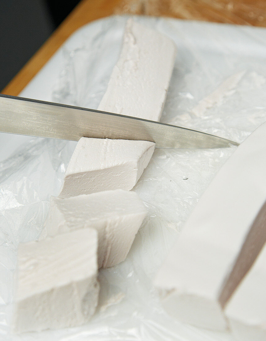 A marshmallow mass being cut