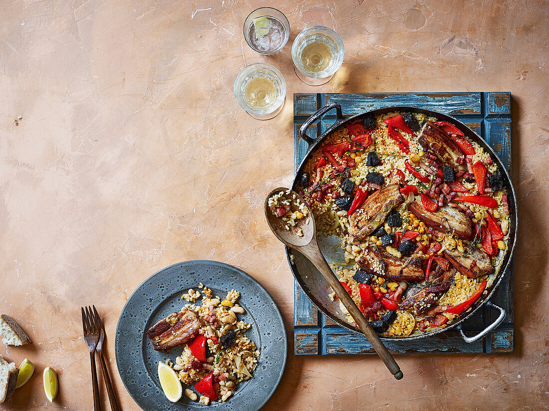 Arroz al horno - paella rice with pork belly, black pudding and red pepper