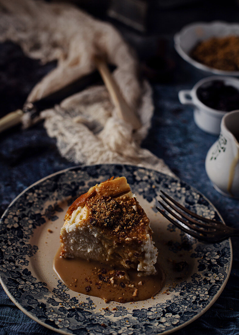 Cheese cake with delicious liquid caramel in composition with ingredients and utensil