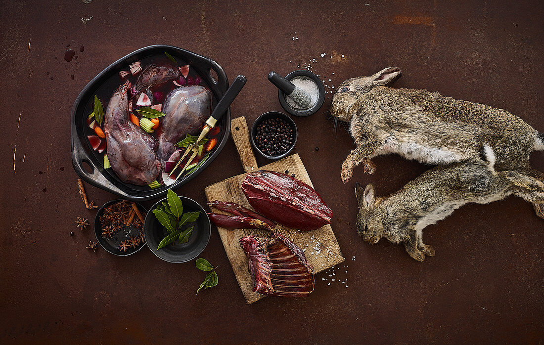 An arrangement of preserved rabbit legs and dead rabbits
