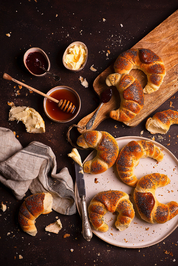 Butter croissants with poppy seeds with butter and honey