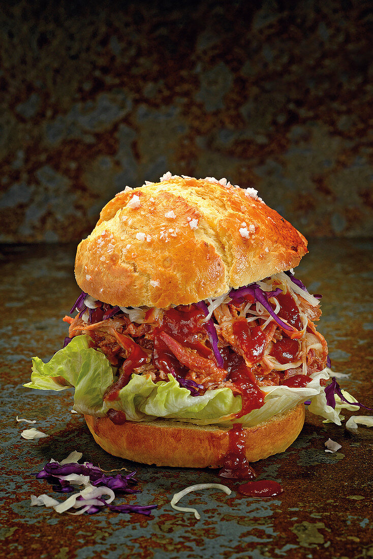 A pulled pork burger with red and white coleslaw