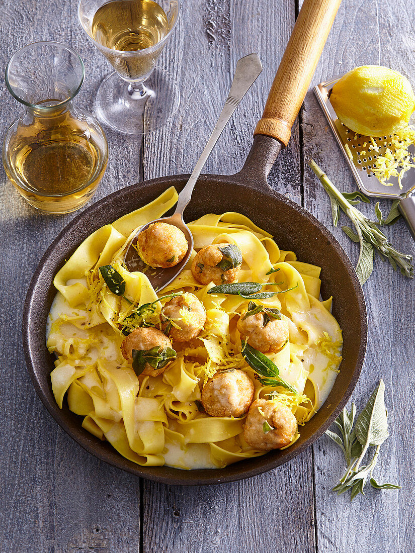 Pasta with chicken balls and lemon sauce