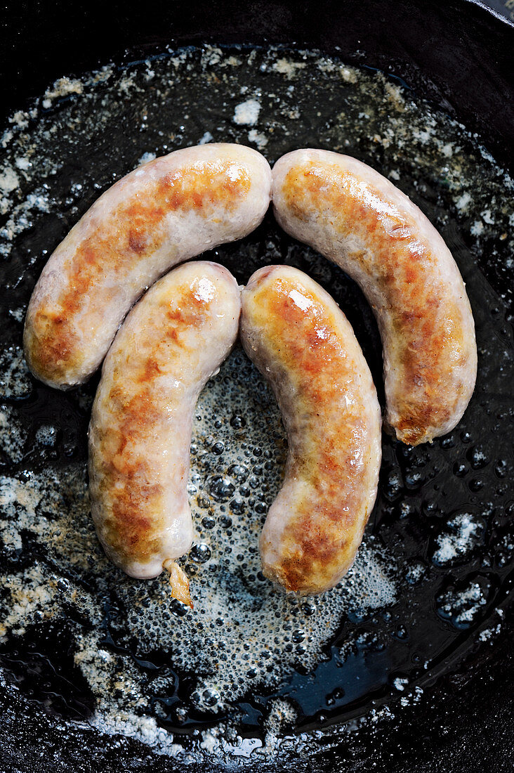 Coarsely ground sausage in a pan