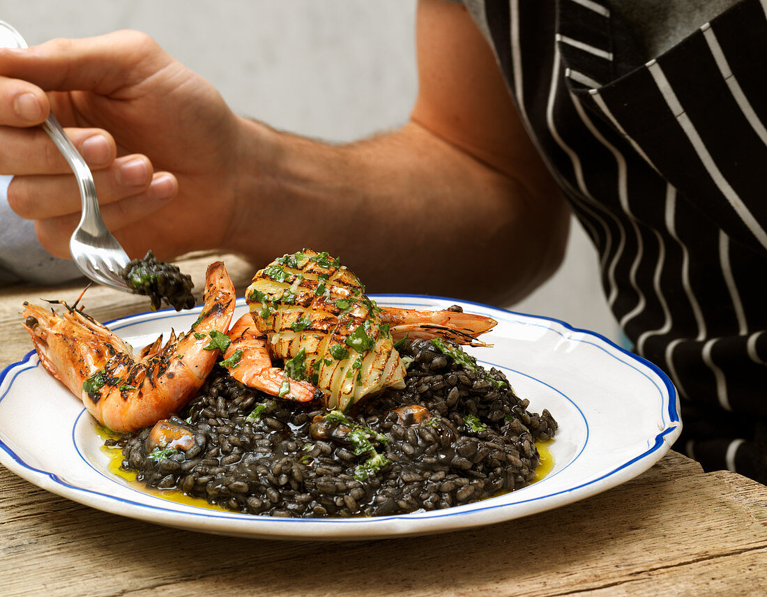 Squid ink risotto with seafood