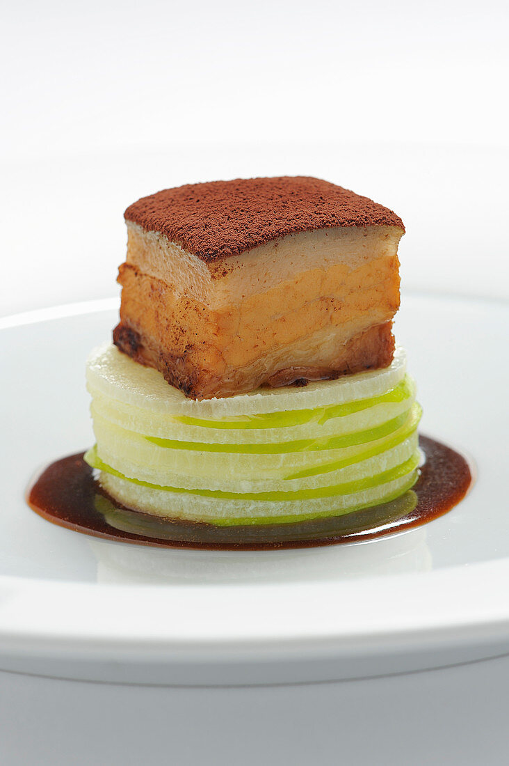 Pork belly with radish cake, cocoa and an olive reduction