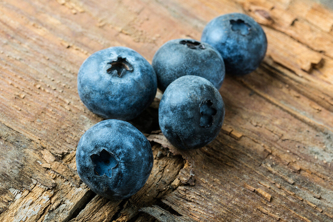 Blueberries on a wooden surface