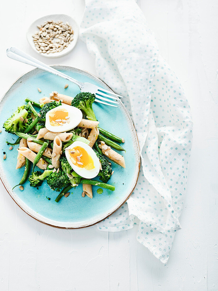Broccoli pasta salad with eggs and sunflower seeds