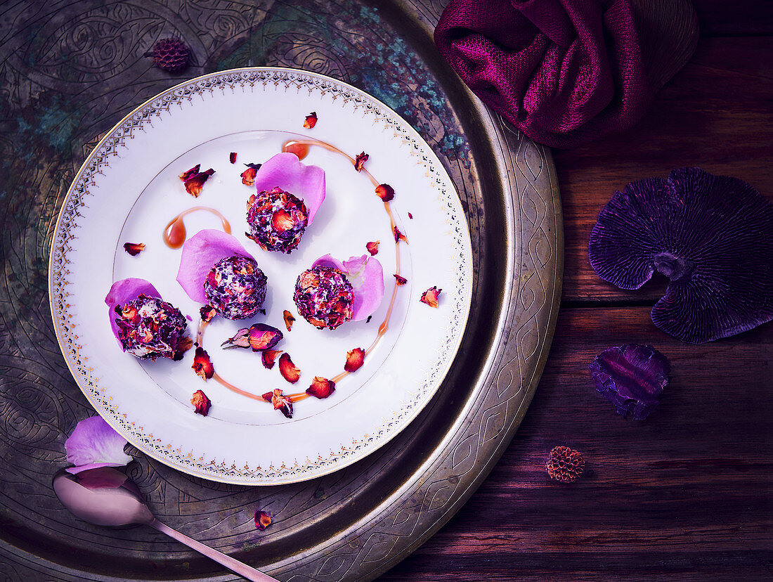 Laddu (Indian dessert) with rose petals