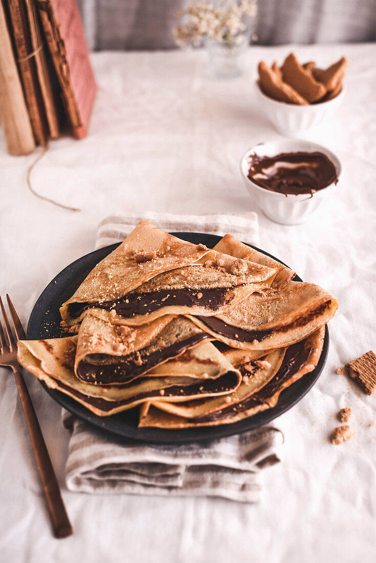 Crepes with chocolate cream and nuts