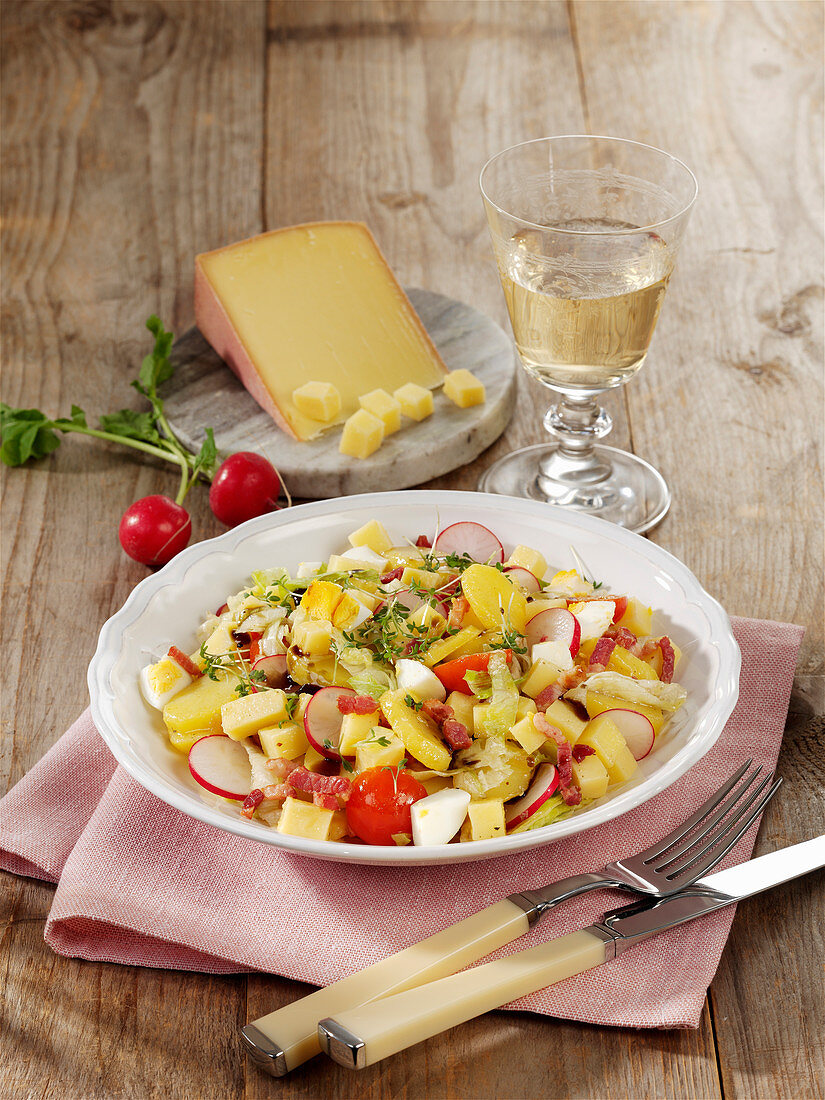 Potato and cheese salad with radishes and bacon