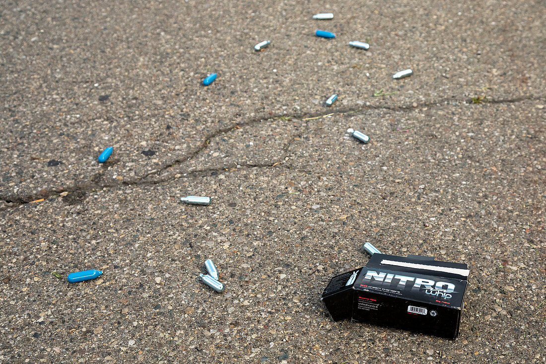 Discarded laughing gas capsules