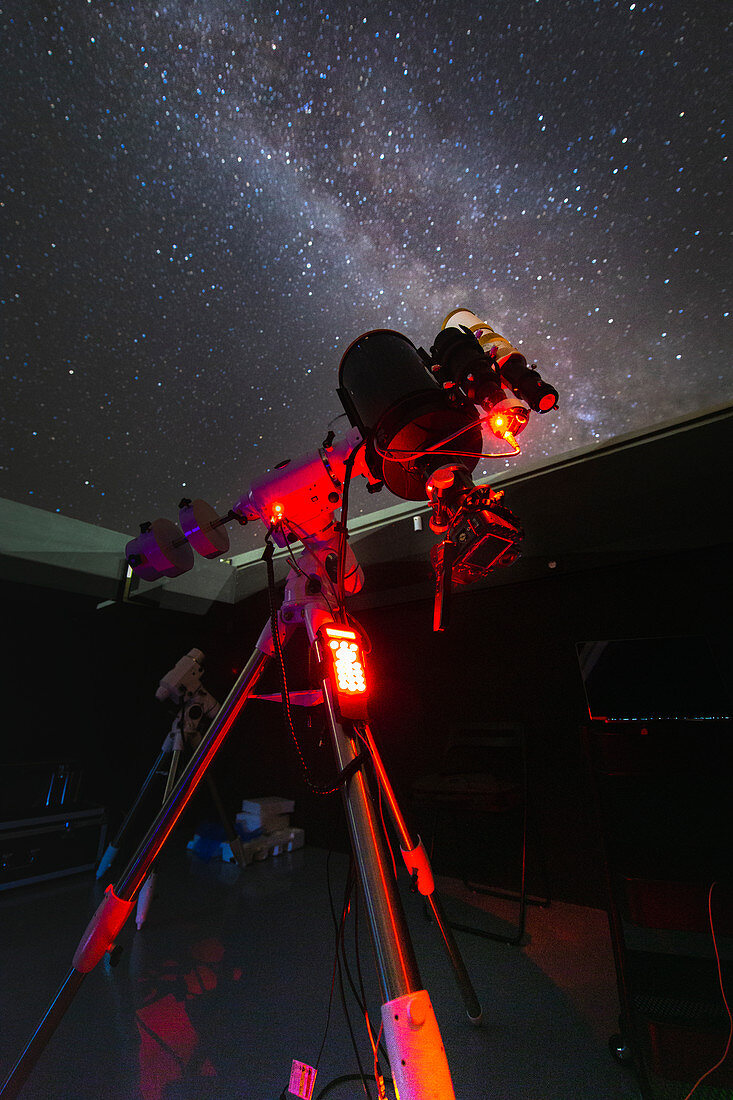 Telescope at an observatory with the Milky Way