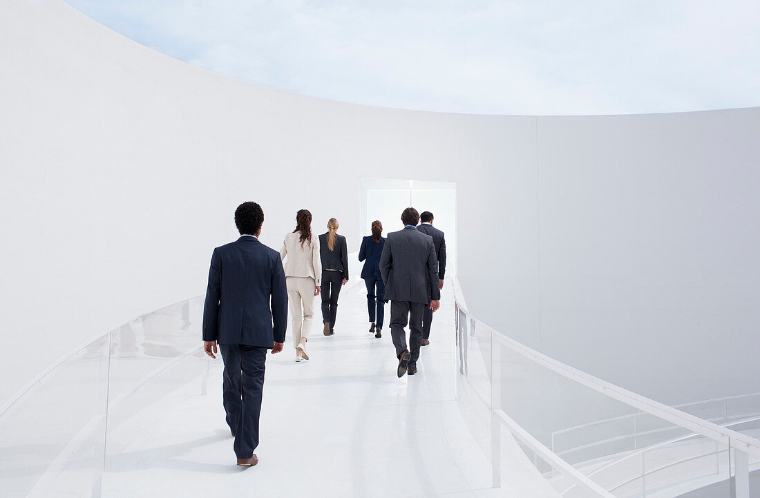 Business people walking toward doorway