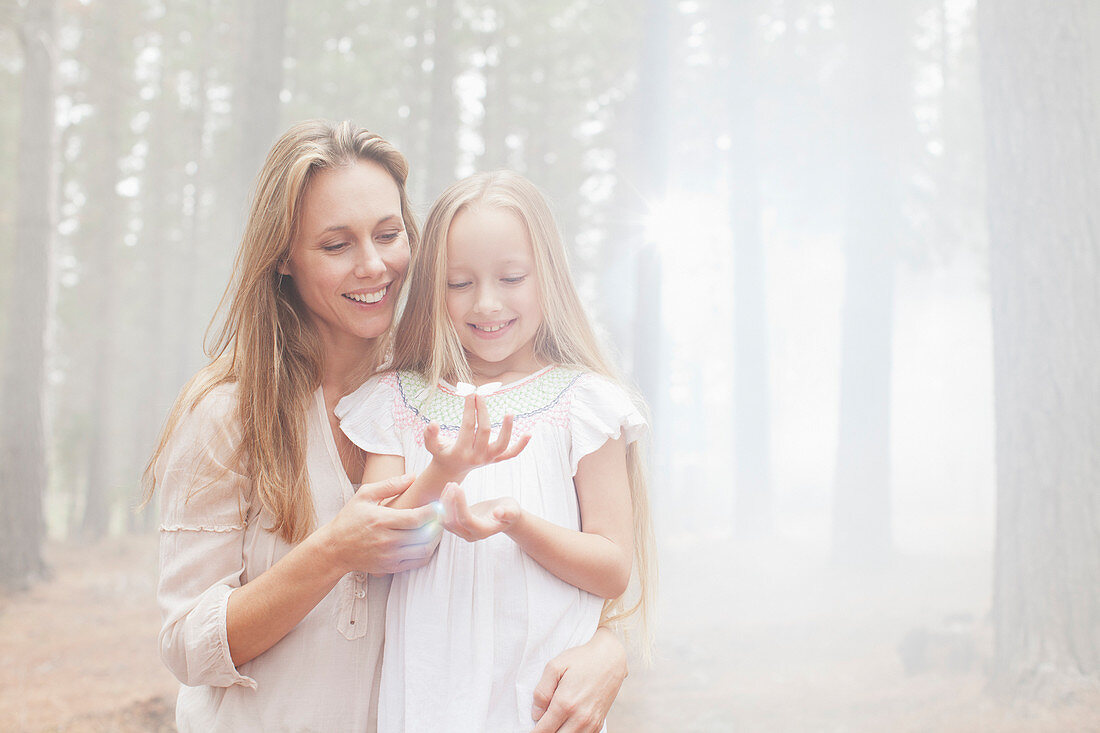 Smiling mother and daughter