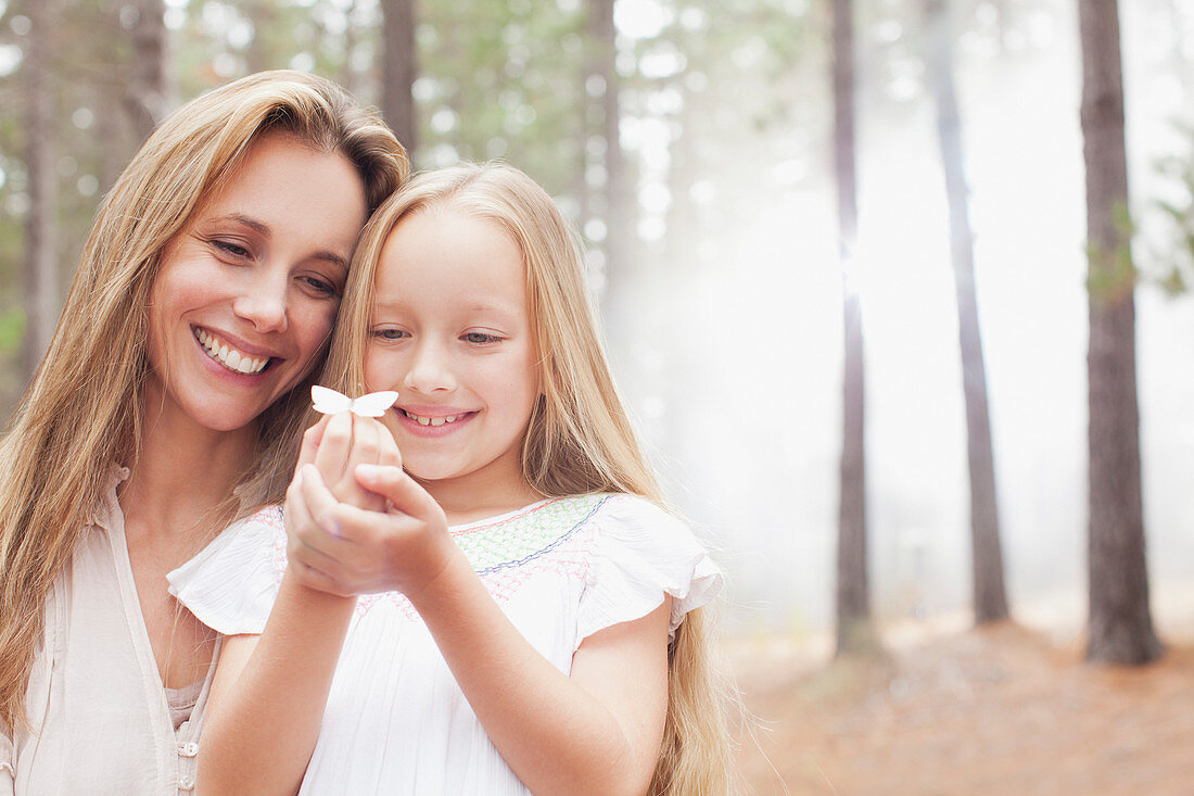 Smiling mother and daughter