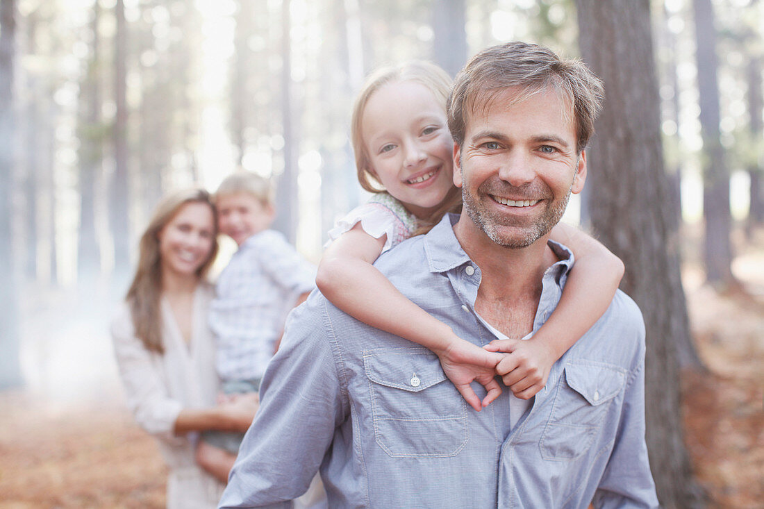 Portrait of smiling family in woods