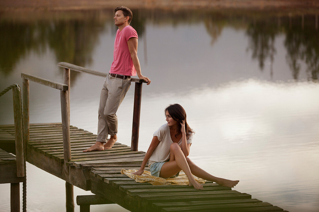 Serene couple on dock over lake