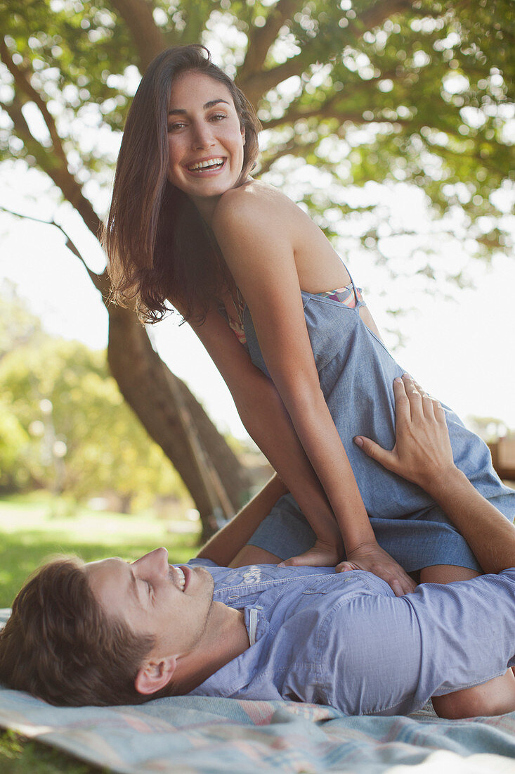 Portrait of smiling couple on blanket