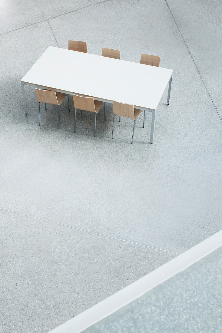 Table and chairs in empty lobby