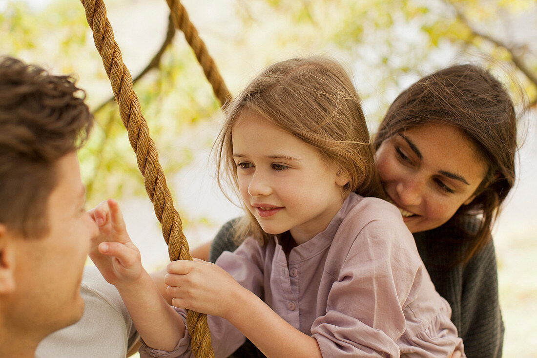 Close up of family on swing