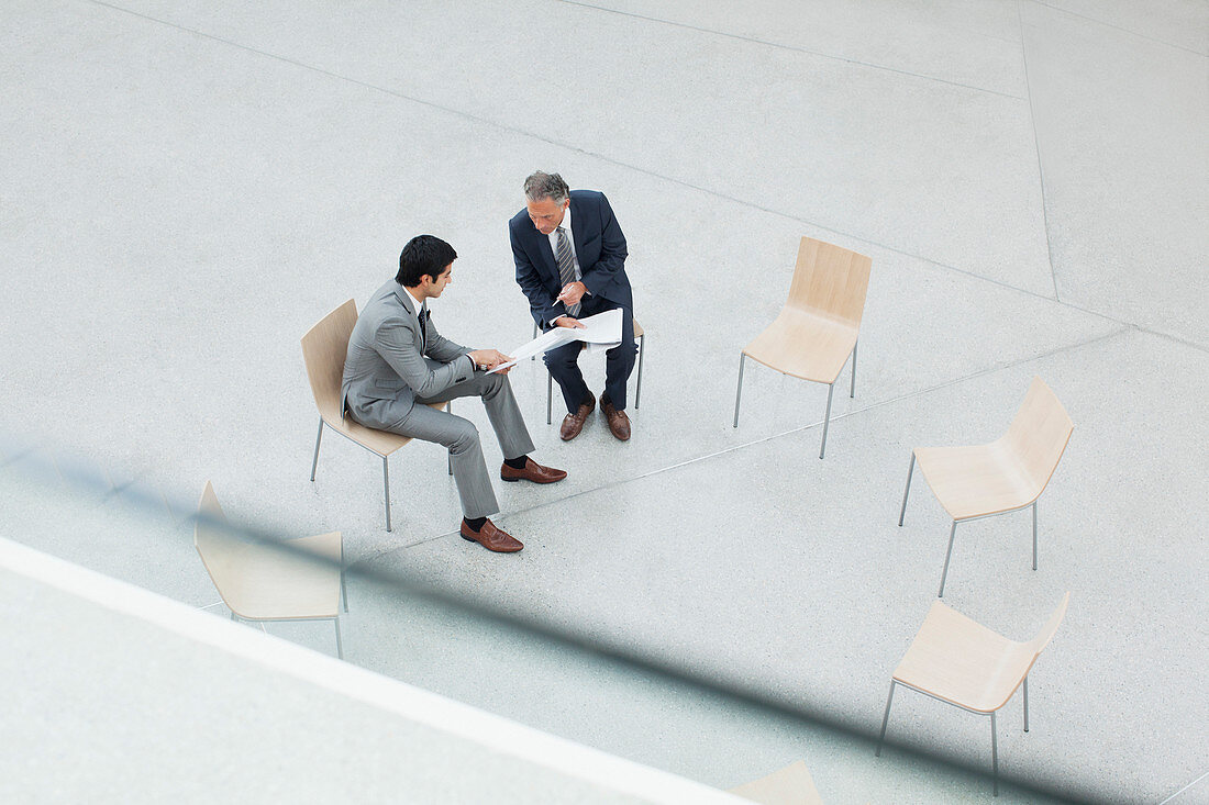 Businessmen reviewing paperwork