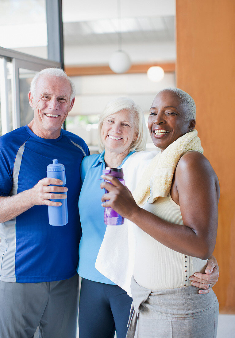 Older people drinking water after workout