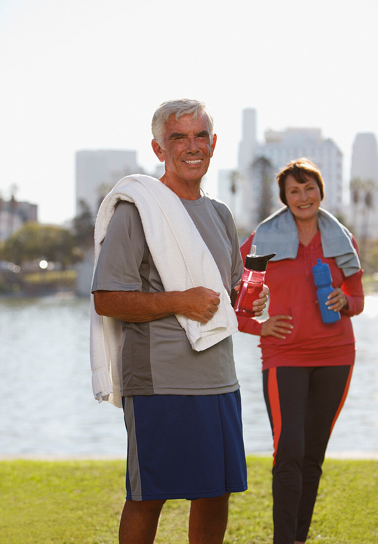 Older couple drinking water after workout