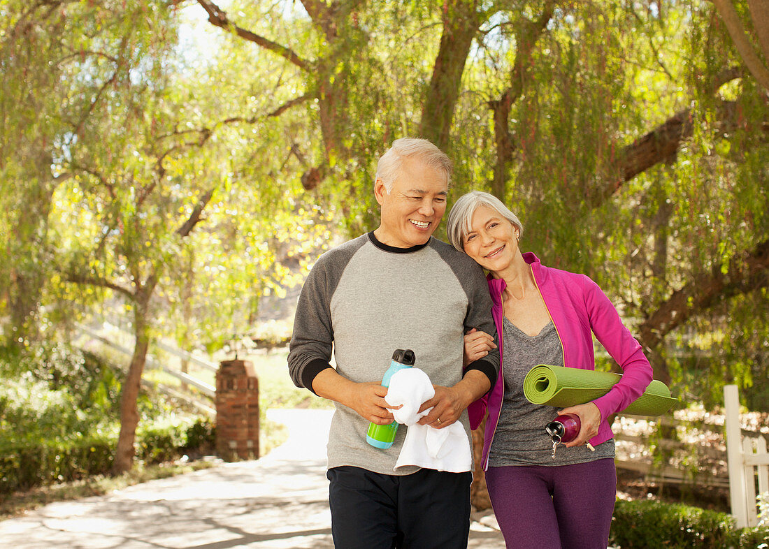 Older couple walking together outdoors