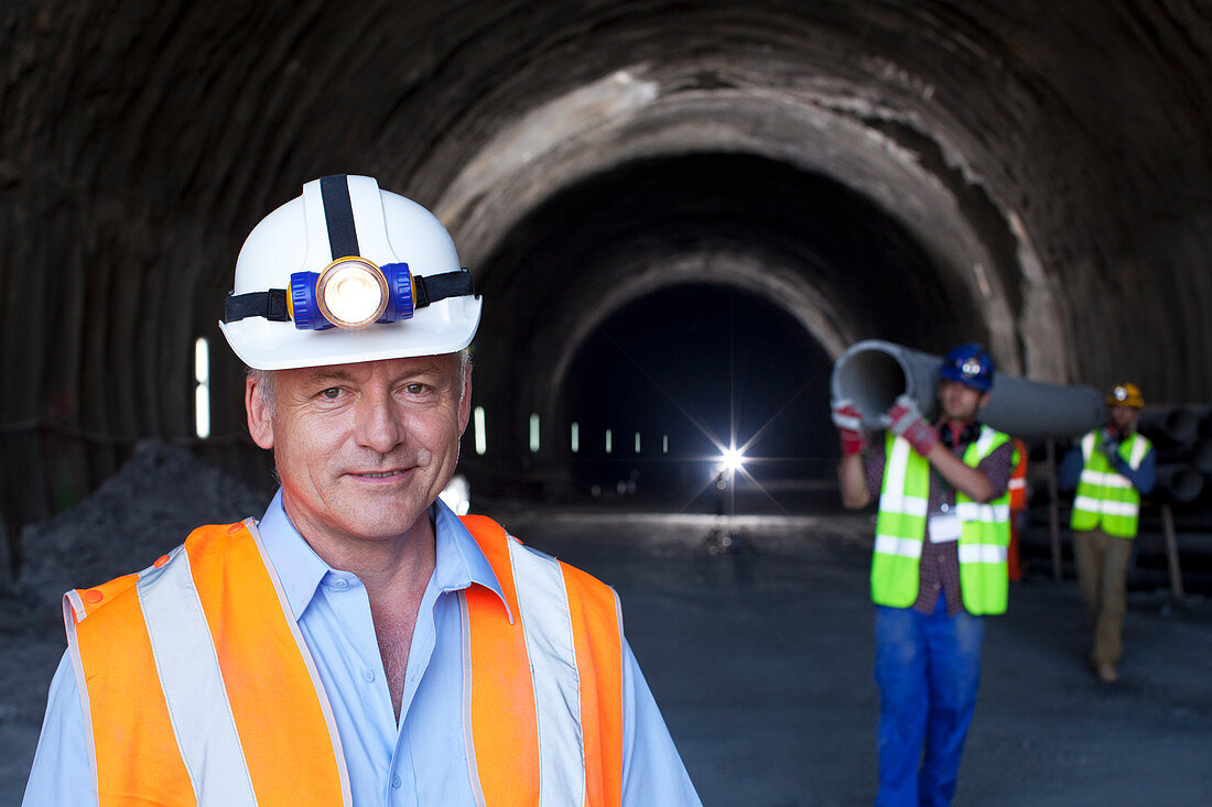Businessman standing in tunnel