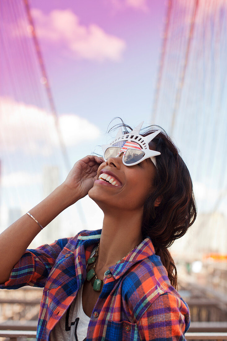 Woman wearing novelty sunglasses outdoors