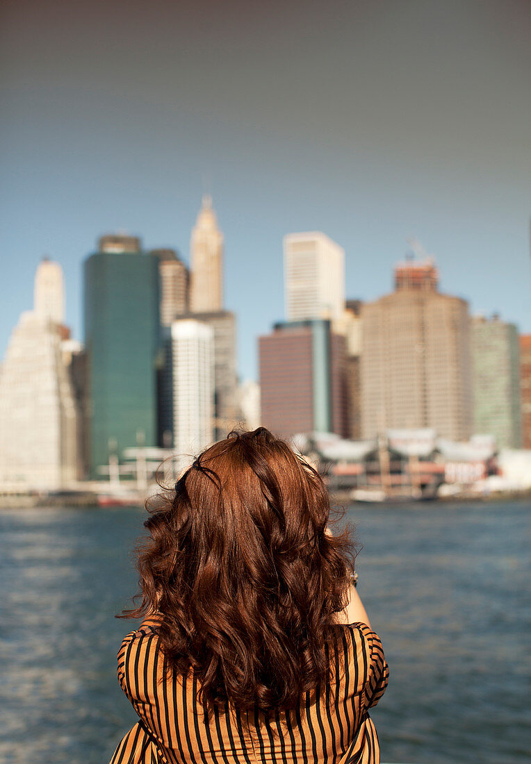 Woman taking picture of urban cityscape