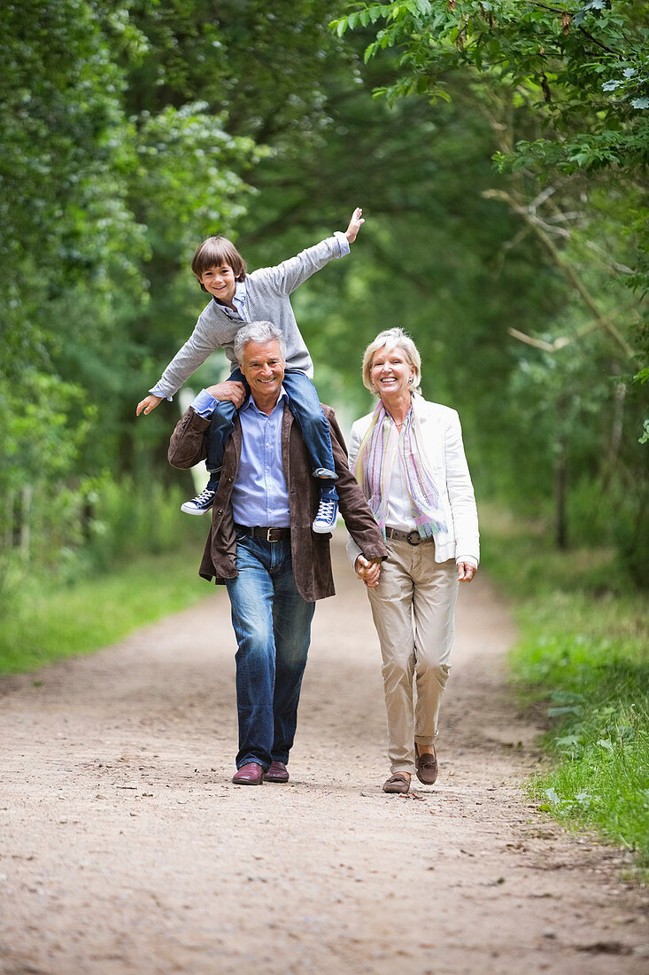 Couple walking with grandson